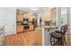 Bright kitchen with stainless appliances, granite counters, barstool seating, and ample cabinet space at 105 Old Barn Way, Wendell, NC 27591