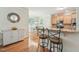 Kitchen with granite countertop, adjacent to eating area, offering lots of natural light at 105 Old Barn Way, Wendell, NC 27591