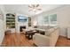 Cozy living room featuring a fireplace, built-in shelving, and comfortable seating area at 105 Old Barn Way, Wendell, NC 27591