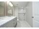 Beautiful bathroom with dual vanity, marble countertop, and tiled shower at 1110 Elmira Ave, Durham, NC 27707