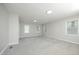 Spacious bedroom with multiple windows and neutral carpet at 1110 Elmira Ave, Durham, NC 27707