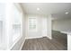 Open dining room with large window and modern floors at 1110 Elmira Ave, Durham, NC 27707