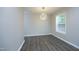 Dining area with modern chandelier and large window at 1110 Elmira Ave, Durham, NC 27707