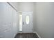 Bright entryway with closet and decorative oval glass door at 1110 Elmira Ave, Durham, NC 27707