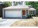 Charming one-story home with a bright red front door and attached garage at 1110 Elmira Ave, Durham, NC 27707