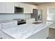 Modern kitchen featuring stainless steel appliances and a large island at 1110 Elmira Ave, Durham, NC 27707