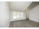 Bright living area featuring ample natural light and wood flooring at 1110 Elmira Ave, Durham, NC 27707