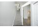 Carpeted staircase leading to upper level with modern gray walls at 1110 Elmira Ave, Durham, NC 27707