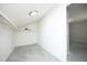 A well-lit walk-in closet with carpet and a clothing rod providing ample storage space at 1110 Elmira Ave, Durham, NC 27707