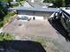 Aerial view of brick patio with seating, covered area, firewood, and RV parking at 112 S Joyland St, Durham, NC 27703