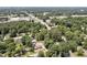 Aerial view of property surrounded by lush greenery with nearby roads, ideal for development and commercial vicinity at 112 S Joyland St, Durham, NC 27703