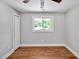 Bedroom featuring a ceiling fan and a window view at 112 S Joyland St, Durham, NC 27703