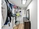 This large walk-in closet features built-in white shelving, laminate flooring, and a small dresser at 112 S Joyland St, Durham, NC 27703