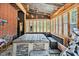 Inviting indoor hot tub room with natural light, wood accents, and exercise equipment for relaxation and wellness at 112 S Joyland St, Durham, NC 27703