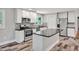 Modern kitchen with granite countertops, stainless steel appliances, and a stylish central island at 112 S Joyland St, Durham, NC 27703