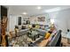 This spacious living room includes a large sectional sofa and a glass coffee table on a decorative rug at 112 S Joyland St, Durham, NC 27703