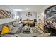 This cozy living room features two couches and a glass coffee table on top of a printed rug with lots of decor at 112 S Joyland St, Durham, NC 27703