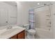 Clean bathroom featuring a tub with shower and cherry vanity at 1120 Renewal Pl # 111, Raleigh, NC 27603