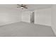 Spacious carpeted bedroom featuring a ceiling fan and neutral paint throughout at 1120 Renewal Pl # 111, Raleigh, NC 27603