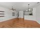 Spacious living area with hardwood flooring and view to the kitchen and staircase at 1120 Renewal Pl # 111, Raleigh, NC 27603