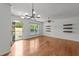 Open living room features hardwood floors, lots of natural light and views to the yard at 1120 Renewal Pl # 111, Raleigh, NC 27603