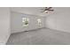Large main bedroom with neutral carpet and natural light from two windows at 1120 Renewal Pl # 111, Raleigh, NC 27603