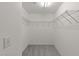 Spacious walk-in closet with carpeted floors and wire shelving at 1120 Renewal Pl # 111, Raleigh, NC 27603