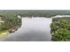 Picturesque aerial shot of a lake surrounded by lush green trees at 1134 Deerfoot Trail Trl, Sanford, NC 27332