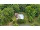 Community pool surrounded by green space and tall trees at 1134 Deerfoot Trail Trl, Sanford, NC 27332