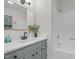 Bathroom featuring modern vanity with framed mirror and shower with tub at 1134 Deerfoot Trail Trl, Sanford, NC 27332