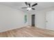Bright bedroom with hardwood floors, ceiling fan, window and door to closet at 1134 Deerfoot Trail Trl, Sanford, NC 27332