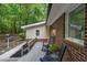 Cozy deck with wood floors and two rocking chairs, perfect for enjoying the surrounding greenery at 1134 Deerfoot Trail Trl, Sanford, NC 27332