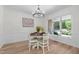 Elegant dining room featuring stylish chandelier, and a view of the backyard at 1134 Deerfoot Trail Trl, Sanford, NC 27332