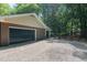 A detached two car garage with ample parking on gravel drive at 1134 Deerfoot Trail Trl, Sanford, NC 27332