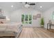 Spacious main bedroom with vaulted ceiling, large windows and wood grain floors at 1134 Deerfoot Trail Trl, Sanford, NC 27332