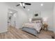 Cozy main bedroom features new flooring, neutral paint, and a ceiling fan at 1134 Deerfoot Trail Trl, Sanford, NC 27332