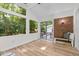 Bright sun room boasting exposed brick, large windows and backyard views at 1134 Deerfoot Trail Trl, Sanford, NC 27332