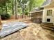 Large backyard featuring a stamped patio, screened-in porch, and wood fence at 121 Chimney Rise Dr, Cary, NC 27511