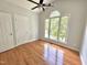Bedroom with a large window and hardwood floors at 121 Chimney Rise Dr, Cary, NC 27511