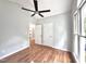 Bedroom with hardwood floors, bright light, and ensuite bathroom at 121 Chimney Rise Dr, Cary, NC 27511