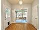 Dining area featuring natural light, hardwood floors, and access to screened-in back porch at 121 Chimney Rise Dr, Cary, NC 27511