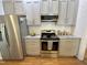 Bright kitchen featuring stainless steel appliances, subway tile backsplash and shaker cabinets at 121 Chimney Rise Dr, Cary, NC 27511