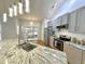 Bright kitchen with granite counters, island sink, stainless appliances, and access to outdoor deck at 121 Chimney Rise Dr, Cary, NC 27511