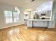Modern kitchen with an island, stainless steel appliances, and stylish lighting, adjacent to the living space at 121 Chimney Rise Dr, Cary, NC 27511