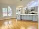 Open concept living room featuring hardwood floors, decorative lighting, and views to outside deck at 121 Chimney Rise Dr, Cary, NC 27511