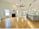 Spacious living room featuring a fireplace, large windows, and hardwood floors at 121 Chimney Rise Dr, Cary, NC 27511