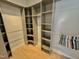 Custom walk-in closet with built-in shelving units at 121 Chimney Rise Dr, Cary, NC 27511