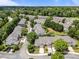 Beautiful aerial view of townhomes in a neighborhood with mature trees and manicured landscaping at 12221 Orchardgrass Ln, Raleigh, NC 27614
