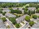 Beautiful aerial view of townhomes near a golf course in a neighborhood with mature trees and manicured landscaping at 12221 Orchardgrass Ln, Raleigh, NC 27614