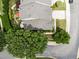 An aerial view showing the roof and landscaping of a well maintained townhome with a patio at 12221 Orchardgrass Ln, Raleigh, NC 27614
